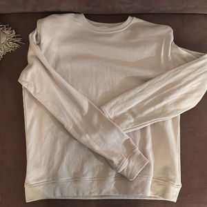 Light purple sweater. Never worn. Padded shoulder.